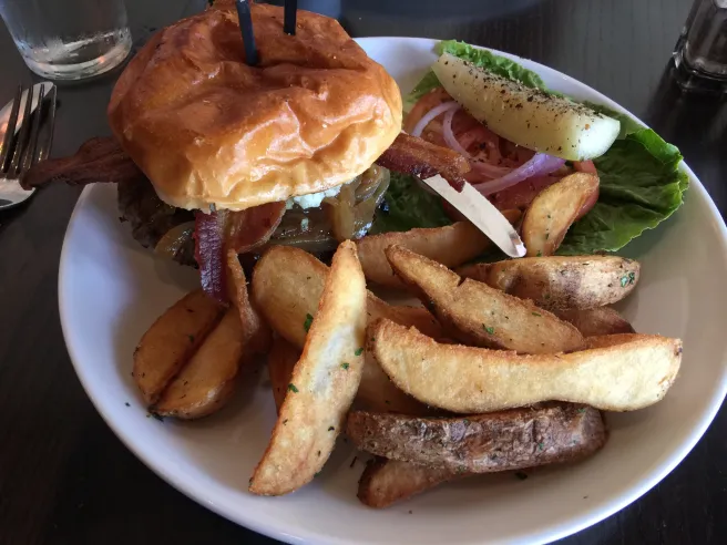 The Heights signature dishes Heights Burger, Lakewood Migas, Heights Grilled Chicken Salad.